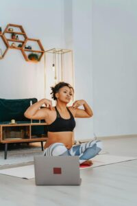 Student on a yoga mat doing exercises to help her mental health